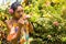 Woman sniffs a flower