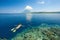 Woman snorkeling in clear tropical waters on a background of isl