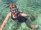 Woman snorkeling in the turquoise sea