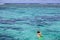 Woman snorkelling alone in Rarotonga Cook Islands