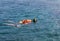 Woman snorkelling in andaman sea at phi phi islands, Thailand