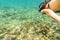 Woman snorkelling over floor of tropical sea