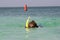 Woman snorkles in the caribbean
