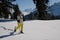 Woman snow shoeing in the mountains