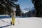 Woman snow shoeing in the mountains