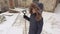 Woman with snow shovel before working