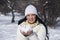 Woman with snow in a winter sunny day