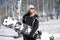 Woman snowboarder holding board in hand in snow winter in sportswear