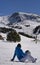 Woman snowboarder looking the Snowboard jump park in El tarter sector of Grandvalira, Andorra