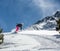 Woman snowboarder in motion in mountains