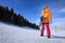 Woman snowboarding in winter mountains