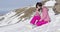Woman on snowy mountain slope