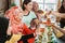 Woman social gathering cheering their glass together