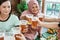 Woman social gathering cheering their glass together