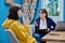 Woman social worker, mentor interviewing, talking to young female in office