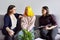 Woman social worker talking to mother and daughter teenage girl