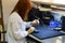 Woman Soldering a circuit board in her tech office.Close up of female engineer