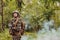 Woman soldier ready for battle wearing protective military gear and weapon