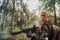 Woman soldier ready for battle wearing protective military gear and weapon