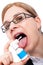 Woman with sore throat using oral spray