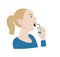 Woman with sore throat using throat spray.