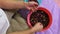 Woman sorting colorful beans