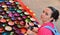 Woman with souvenir colourfully lacquer bowls on the market in Luang Prabang, Laos