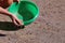 A woman is sowing grass seeds. Lawn installation