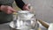 The woman sows flour in the kitchen. Making baked goods and bread