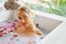 Woman Spa Flower Bath. Aromatherapy. Relaxing Rose Bathtub.