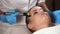 Woman in spa salon getting facial rejuvenation procedure. Mesoporation.