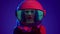 Woman in space helmet. Multi-colored neon lighting.