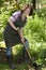 Woman with spade in a garden