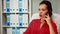 Woman speaking on phone during work