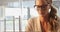 Woman in spectacles sitting in cafe