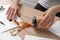 Woman spilled coffee on wooden office desk, closeup