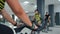 Woman spinning bike at cycling class in gym club. Group fitness people training bike exercise. Bicycle training in