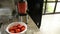 Woman spinning tomato juice, Homemade organic tomato juice