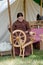 Woman spinning wool