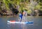 Woman Splashing Water on Paddle Board Stand Up Paddle-Board