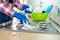 Woman with sponge and rubber protective glove used to wipe down an oven range top