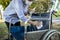 Woman is spraying alcohol,disinfectant spray on wheelchair of old elderly,during the pandemic of Covid-19,Coronavirus disease,wipe