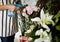 Woman Spraying Flowers to Refreshing in Flora Shop