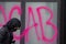 Woman spraying graffiti at Westlake Center in downtown Seattle on May 30 2020