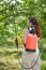 Woman spraying tree