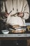 Woman spreading butter to healthy rye Swedish bread slice