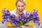 Woman with spring iris flower roar