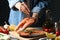 Woman sprinkles salt on salmon meat Cooking salmon on gray table