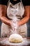 Woman sprinkling flour
