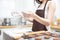 Woman sprinkling flour